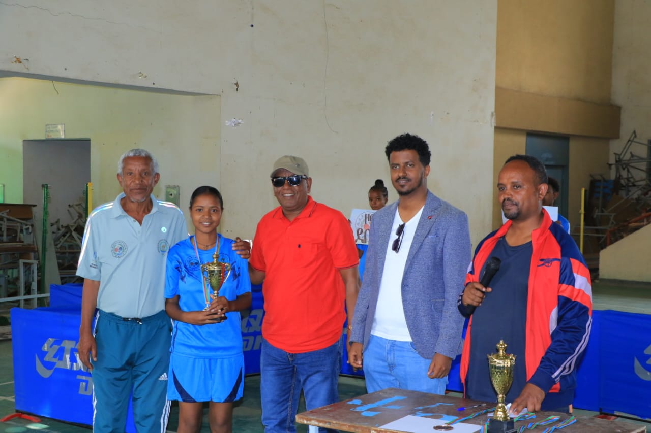 Participants and officials standing together at the venue