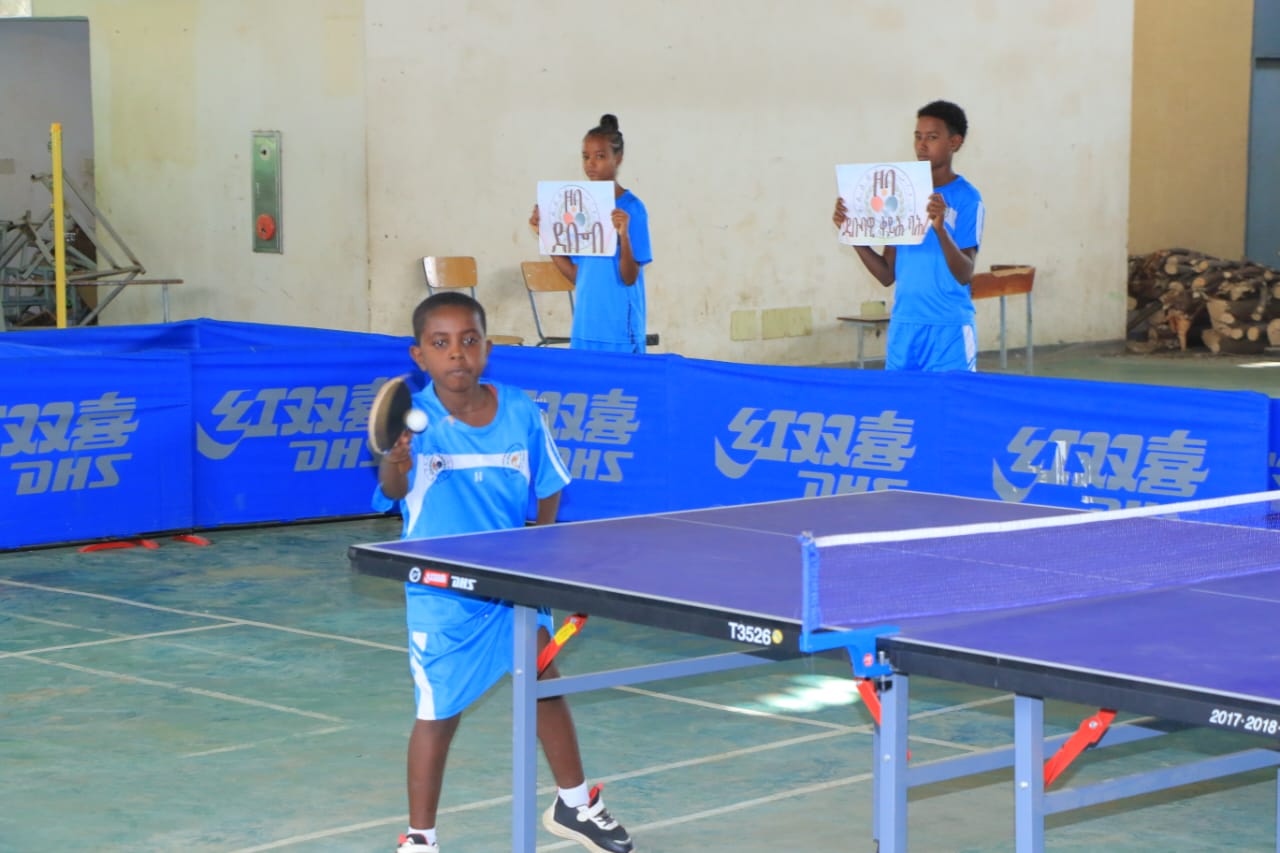 Players taking part in a table tennis practice session