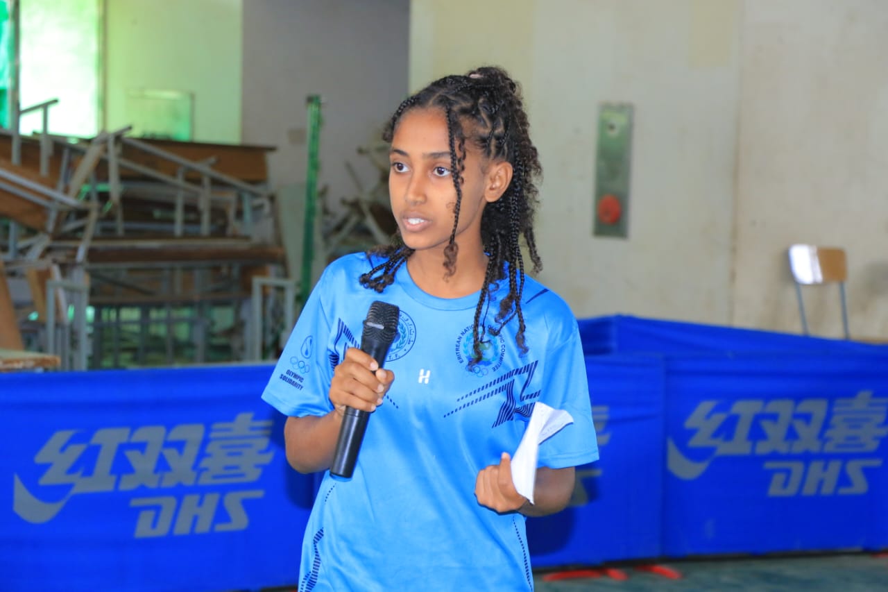 A young participant speaking into a microphone